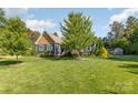 Charming home featuring a lush green lawn and well-maintained landscaping and traditional American architecture at 219 Reese Wilson Rd, Belmont, NC 28012
