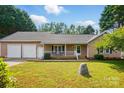 Inviting single-story home with a covered front porch, attached garage, and meticulously kept front yard at 2379 Whitley Rd, Fort Mill, SC 29708
