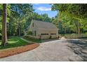 Spacious two-car garage with white siding and a well-maintained driveway and yard at 2500 Little Cove Rd, Charlotte, NC 28270