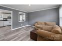 Cozy living room with gray walls, modern floors, and comfortable couches at 3219 Spring Valley Dr, Gastonia, NC 28052