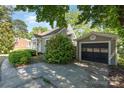 Cozy home with a detached garage and a long private driveway at 3612 The Plz, Charlotte, NC 28205