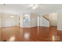 Bright and airy living room with hardwood floors and archways at 6724 Long Nook Ln, Indian Trail, NC 28079
