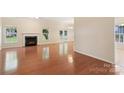 Spacious living room with a fireplace and hardwood floors at 6724 Long Nook Ln, Indian Trail, NC 28079
