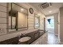 Modern bathroom with double vanity, granite countertops, and stylish finishes at 7740 Freeze Rd, Kannapolis, NC 28081