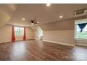 Spacious bonus room with hardwood floors, large windows, and ample natural light at 7740 Freeze Rd, Kannapolis, NC 28081