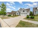 Desirable street with beautiful homes, well-kept lawns, and inviting curb appeal at 8210 Festival Way, Charlotte, NC 28215