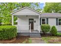 Close-up of a charming front porch with a white railing and a welcoming entrance at 93 34Th Street Nw Ct, Hickory, NC 28601
