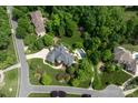 Aerial view of the estate home, highlighting the meticulously landscaped grounds and private backyard area at 1001 Medinah Ct, Waxhaw, NC 28173