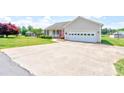 Spacious driveway leading to a single-story home with a two-car garage and manicured landscaping at 110 Carol Lyn Dr, Kings Mountain, NC 28086