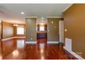 Open-concept living room with hardwood floors, neutral paint, and access to kitchen at 110 Carol Lyn Dr, Kings Mountain, NC 28086