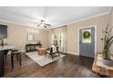 Open-concept living room boasts hardwood floors, natural light and stylish decor at 12224 Huntersville Concord Rd, Huntersville, NC 28078