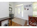 Bright foyer with wood floors, a decorative front door, and stylish accents, creating a welcoming entrance at 125 Mariner Pointe Ln, Mooresville, NC 28117