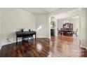 Spacious living room featuring hardwood floors, neutral walls, and ample natural light at 1403 Rosemont Dr, Fort Mill, SC 29707