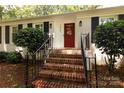 Inviting front entrance with a brick staircase and a vibrant red door at 1427 Worcaster Pl, Charlotte, NC 28211