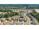 Overhead view of a well-planned neighborhood, highlighting the home's location near lush greenery and community amenities at 15108 Montage Ln, Charlotte, NC 28278