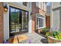 Inviting entryway showcases a black multi-paneled front door, sidelight window, and neutral decor at 16216 Woolwine Rd, Charlotte, NC 28278