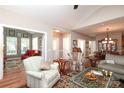 Spacious living area featuring hardwood floors, neutral walls, and comfortable seating arrangement at 2114 N Castle Ct, Matthews, NC 28105