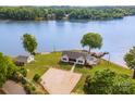Picturesque waterfront property with guest house, private dock, pool, and basketball court at 235 River Loop Rd, Belmont, NC 28012
