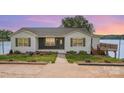 Charming single-story home with welcoming front yard and dark painted accent wall at 235 River Loop Rd, Belmont, NC 28012