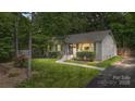 Charming home with well-maintained lawn and paved walkway at 301 Deer Creek Dr, Matthews, NC 28105