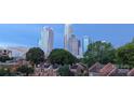 Stunning city skyline view from a home in a quiet neighborhood. For sale by Canopy MLS 2025 at 301 W 10Th W St, Charlotte, NC 28202