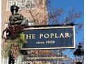 Charming historical building sign 'The Poplar', built circa 1929, with decorative holiday embellishments at 301 W 10Th W St, Charlotte, NC 28202