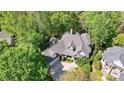 Aerial view of a well-maintained house, complete with lush surroundings at 3508 Mountain Cove Dr, Charlotte, NC 28216