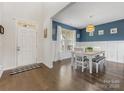 Inviting dining room with stylish decor, a large window, and hardwood floors at 405 Winding Oaks Se Ln, Concord, NC 28025