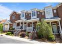 Charming red brick townhomes with inviting front porches and professional landscaping at 4941 S Hill View Dr, Charlotte, NC 28210