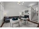 Bright living room featuring a modern fireplace, comfortable seating, and stylish decor at 4941 S Hill View Dr, Charlotte, NC 28210
