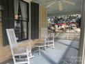 View of the porch with classic rocking chairs, offering an inviting space to enjoy the outdoors at 500 W Council St, Salisbury, NC 28144
