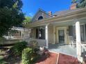 View of the home's porch, with rocking chair, showing railing and column details, perfect for relaxation at 500 W Council St, Salisbury, NC 28144