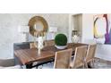 Dining room showcasing a decorative leaf wallpaper and statement mirror at 503 Meadow Ridge Dr, Belmont, NC 28012