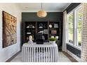 Modern home office featuring custom built-ins, striking decor, and natural light at 503 Meadow Ridge Dr, Belmont, NC 28012