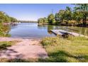 Picturesque lake view with a small dock and easy access to the water, perfect for enjoying outdoor activities at 7733 Skyline Dr, Sherrills Ford, NC 28673