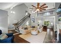 Spacious living room with hardwood floors, fireplace, and vaulted ceilings at 8501 Flanagan Ct, Huntersville, NC 28078