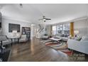 Spacious living room featuring hardwood floors, modern furnishings, and ample natural light at 8702 Aspinwall Dr, Charlotte, NC 28216