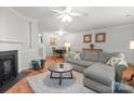 Spacious living area with cozy seating, a fireplace, and an open dining space at 9214 Arbourgate Meadows Ln, Charlotte, NC 28277