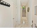 Bright hallway with marble floors, coat rack and view of stairway at 1054 Kenilworth Ave, Charlotte, NC 28204