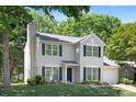 Traditional two-story home with lush green lawn and mature trees at 12624 Cedar Crossings Dr, Charlotte, NC 28273