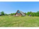 Beautiful A-frame home on sprawling acreage, offering a serene and private retreat at 1307 Tiffany Ln, Shelby, NC 28152