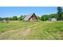 A-frame home on large, green acreage. The property is perfect for quiet, private living at 1307 Tiffany Ln, Shelby, NC 28152