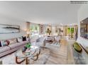 Open concept living room showcasing lots of natural light, hard surface flooring, and modern furnishings at 1611 Spring Lot Dr, Edgemoor, SC 29712