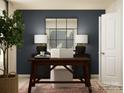 A well-decorated office space with a wooden desk and a comfortable chair for a productive work environment at 1621 Spring Lot Dr, Edgemoor, SC 29712