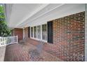 Cozy front porch with brick accents, offering a relaxing outdoor space at 1723 Baskins Hill Rd, Heath Springs, SC 29058