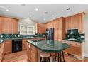 Inviting kitchen with custom cabinetry, tile countertops, and a central island cooktop at 1760 Jacobs Way, Sherrills Ford, NC 28673