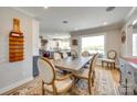 Dining room adjacent to kitchen featuring a large wooden table and chairs and a decorative rug at 1780 Sierra Rd, York, SC 29745