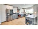 Modern kitchen with stainless steel appliances, gray cabinets, white uppers and beautiful countertops at 1780 Sierra Rd, York, SC 29745