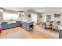 Well-designed kitchen with a farmhouse sink, granite countertops, and open layout to dining area at 1780 Sierra Rd, York, SC 29745