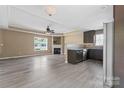 Open concept living room and kitchen featuring hardwood floors, recessed lighting, and granite countertops at 1806 Red Bird Cir, Concord, NC 28025